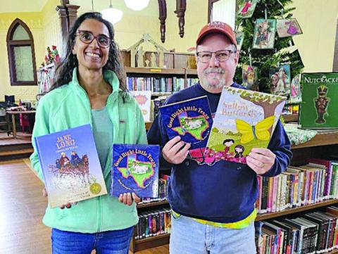Round Top Family Library received books from Night Heron Media just before Christmas. Keelia Ritch (left), library manager, represents RTFL in accepting the donation from Mike Vance (right), Night Heron Media creative/video director.