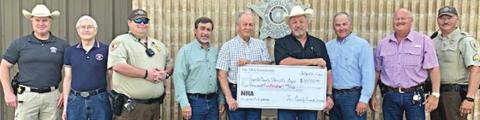 NRA Foundation and Friends of NRA recently presented a $4,500 grant to the Fayette County Sheriff's Office, with the following representatives on hand: (from left) Investigator Kenn Kretz, Charles Murray-Friends of NRA, Deputy Lee Phillips, John Salem-Friends of NRA, Dennis Brower-Friends of NRA, Sheriff Keith Korenek, Craig Schulz-Friends of NRA, Lt. David Beyer and Sgt. Ron Naumann.