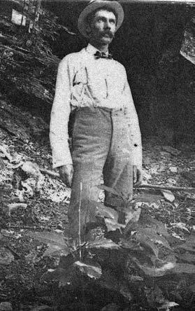 Frank Hausmann standing below the bluff. – Courtesy of Fayette Heritage Museum &amp;Archives