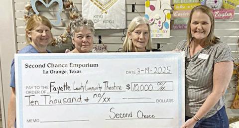 $10,000 check was presented by Second Chance Emporium to Fayette County Community Theatre. Shown are (from left) Marlene Schnell, SCE assistant store director; Darlene Strahan, SCE assistant store director; Gayle Schielack, SCE store director; and Heather Barthelme, FCCT executive director.