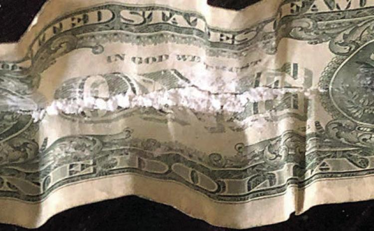 SPD officers found cocaine hidden in a folded dollar bill during a call on Sunday morning that led to the arrest of a Schulenburg man.