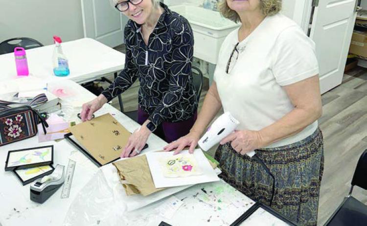 Thanks to Kim Penland (left) and Claire Lewis (right), 99 percent of the framing was completed for the art show “Ageless Artistry,” on Saturday, April 12 from 3 to 5 p.m. at 1206 Kessler Ave. in Schulenburg.