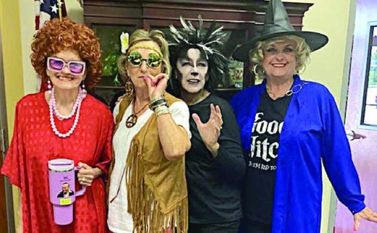 Chosen as the best four costum ed members were (from left) Betty Herzik (Mrs. Roper), Diana Mikesky (Hippie Chick), Marilyn Mokwa (Spooky Black Cat) and Debra Blansitt (the Good/Bad Witch).