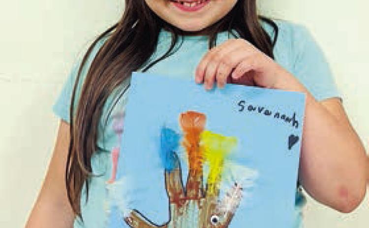 During the last week’s arts and crafts program at the Schulenburg Unit of the Boys &amp; Girls Club, members participated in creating decorations for Thanksgiving such as making hand turkeys and utilizing feathers for a more festive appearance around the Club! Shown is club member Savannah Villanueva. The Boys &amp; Girls Club hopes everyone has a wonderful Thanksgiving!