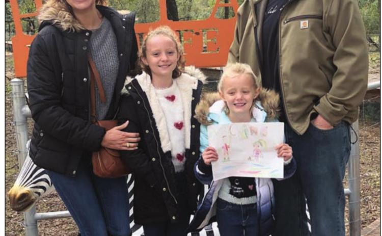 WINNER OF TICKETS TO HATARI – Penelope Bartek (second from right) won four tickets to Hatari Wildlife Park. She is shown with her mother Cara Bartek (left), father Matt Bartek (right) and sister Caroline (second from left).
