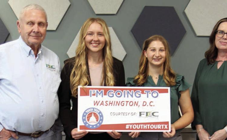 Congrat ulat ing Laney Bludau (second from left) of Hallettsville High School and Gretchen Sacks (second from right) of Round Top-Carmine High School, winners of FEC’s 2026 Government-in-Action Youth Tour contest, are Fayette Electric Cooperative board president Joseph Kruppa (left) and FEC Youth Tour coordinator Tracy Denton (right).