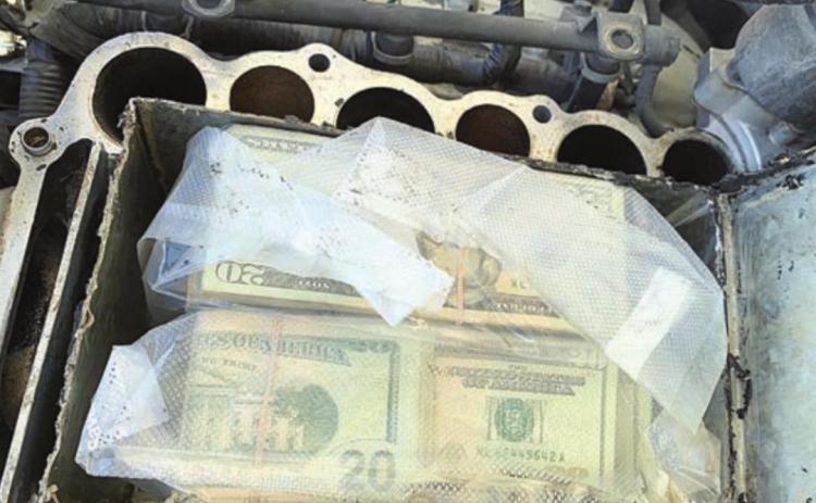 U.S. currency concealed in the engine area in an aftermarket false compartment was located during a traffic stop on I-10 at Flatonia by Drug Interdiction Investigator David Smith.