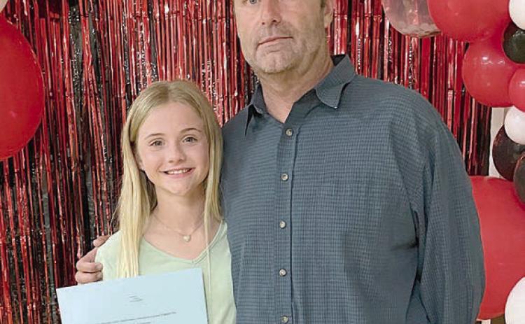Mallory Bonner of St. Rose of Lima Catholic School with her dad, Matt Bonner.