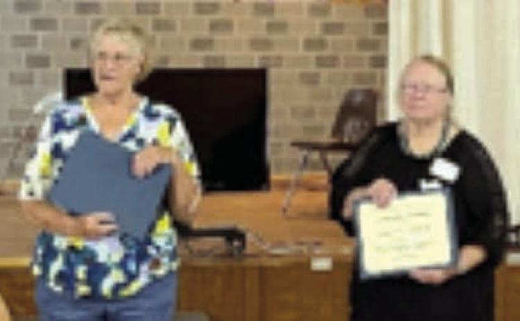 The Texas Treasure Award for the District 11 Texas Extension Education Association went to Marilyn Petrich of Fayette County. The award was accepted by her daughter, Jesse Kokemor (right), and presented by Knellen Quinteros (left), District 11 chair.