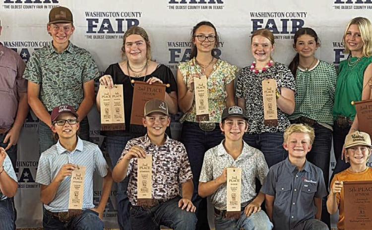 Fayette County 4-H members participating in the Washington County Livestock Judging Contest were (front row, from left) Bowen Bishop, Tate Fritsch, Hudson Holub, Crockett Guenther, Joseph Carrales, Rowdy Guenther, (back row) Rilan Karisch, Holden Holub, Rheagan Karisch, Tatum Fritsch, Kaisley Janecka, Laramie Laake, Hailey Janish, Adalyn Carrales, (not shown) Stockton Emshoff and Emma Zweschper.