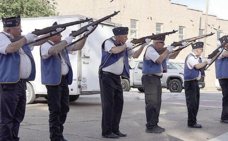Members of the Schulenburg American Legion McBride Post 143 deliver the triple volley salute as part of the patriotic ceremony. Participating were: (from left) Harry Bartosch, Dennis Muhlstein, Jack Niesner, James Brown, C. W. Leonard, Michael Bartos, Rick Todd, and Armen Herzik.