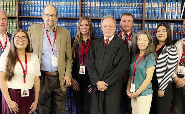 Eight new volunteers for CASA of Bastrop, Fayette &amp; Lee Counties were sworn in on Nov. 18 in Bastrop. Shown are (from left) new CASA volunteers Jim Barringer of Bastrop, Judit Castillo of Elgin, Bill Laubenberg of Elgin and Morgan Heine of Elgin; Benton Eskew, county court at law judge in Bastrop County who performed the swearing-in; and new volunteers Gage Counts of Bastrop, Alma Villareal of Flatonia, Johana Cardenas of Bastrop and Howard Griffith of Bastrop.