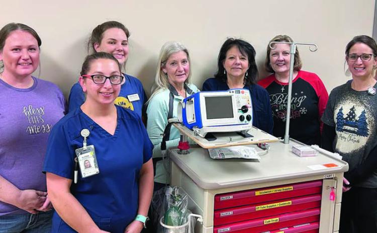 New defibrillator /monitors purchased by St. Mark’s Medical Center in La Grange with funds from Second Chance Emporium (SCE) are shown with (front row, from left) Alyssa Smidovec, RN, St. Mark’s; Ashley Havel, St. Mark’s imaging director; (back row) Stacy Cada, SCE assistant store director; Julia Thomas, SCE assistant store director; Gayle Schielack, SCE store director; Laurie Quitta, RN, St. Mark’s MedSurg director; Linda Morrison, SCE board secretary; and Melissa Taylor, LVN, St. Mark’s.