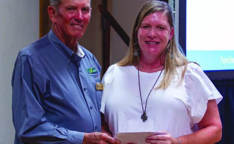 CASA of Bastrop, Fayette and Lee Counties received a $5,000 grant from FEC and CoBank. Shown are (from left) FEC board president David Lehmann and CASA executive director Kristi Bauer.