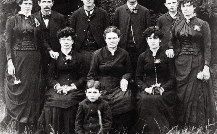 The Louis and Mary (Loessin) Luck Family photographed by G. A. Pannewitz in the mid-1880s. Charles P. Luck is standing second from right. Courtesy of Fayette Heritage Museum & Archives