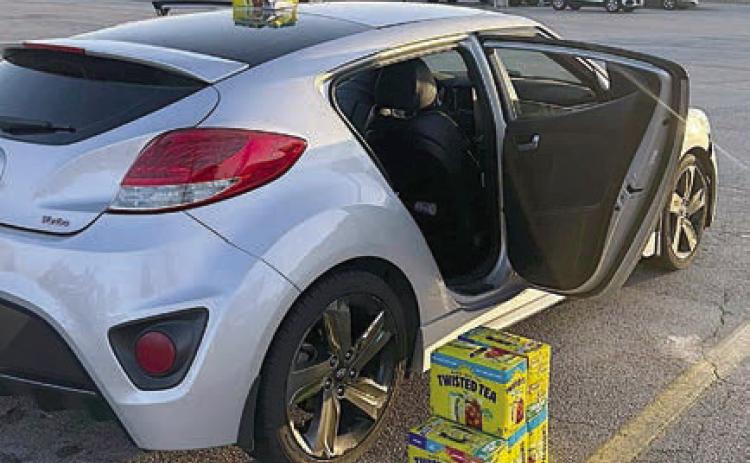 The silver hatchback is pictured after SPD officers stopped it at Love’s Travel Stop in Weimar with the Twisted Tea cases stolen from The Texan in Schulenburg.