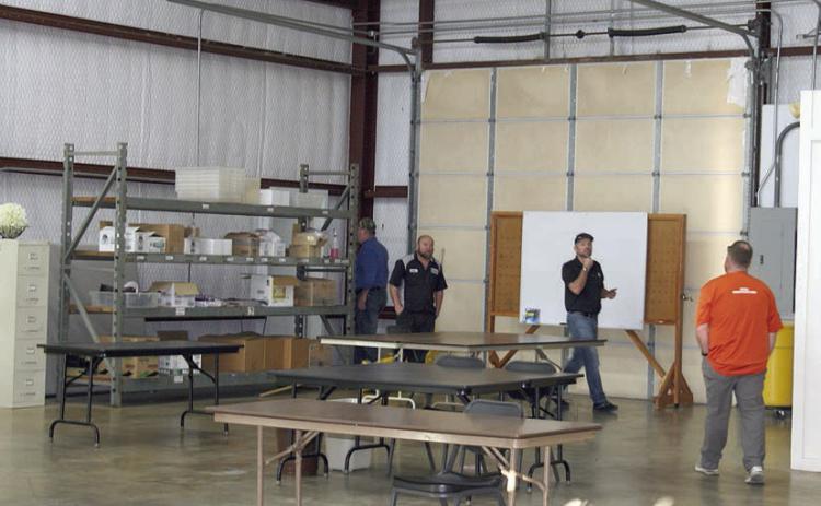 Schulenburg ISD school board members (from left) Mike Zweschper, Jarrod Schramek, Joel Blansitt, and Michael “Dumas” Demel walk through the workshop during their tour of the Henry Dittrich Sr. Enterprises Building last week. Sticker Photo By Darrell Vyvjala