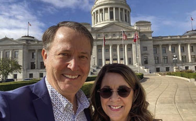 Jim Schmidt, legislative ambassador and executive team member for the National School Chaplain Association, stands before the Arkansas State Capitol with his wife Sheila. Jim Schmidt is from Schulenburg.