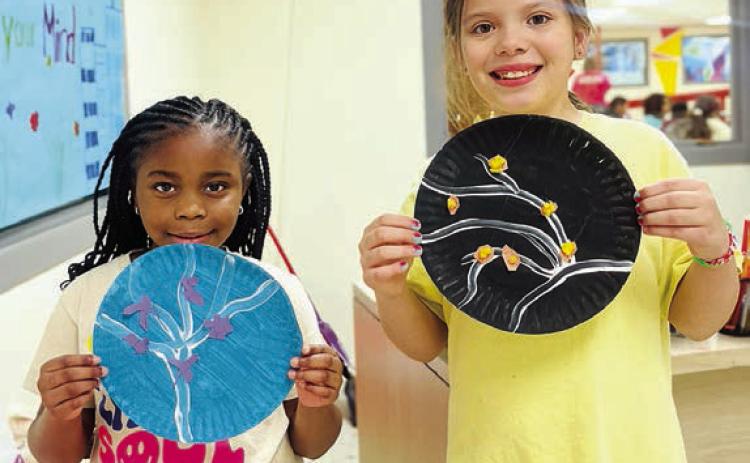 Since it’s the beginning of the spring session at the Schulenburg Unit of the Boys &amp; Girls Club, staff conducted a lovely cherry blossom art project for kids to share with the public! Shown are Club members (from left) Legacy Crenshaw and Nevaeh Muras.