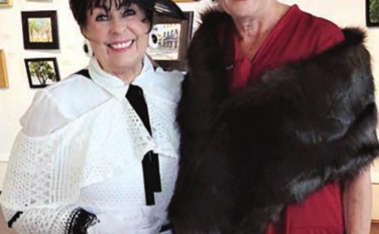 A 1930S THEME was carried out at the celebration. Deborah Moran (left) provided entertainment and is shown with Connie Dittrich (right) of Schulenburg.