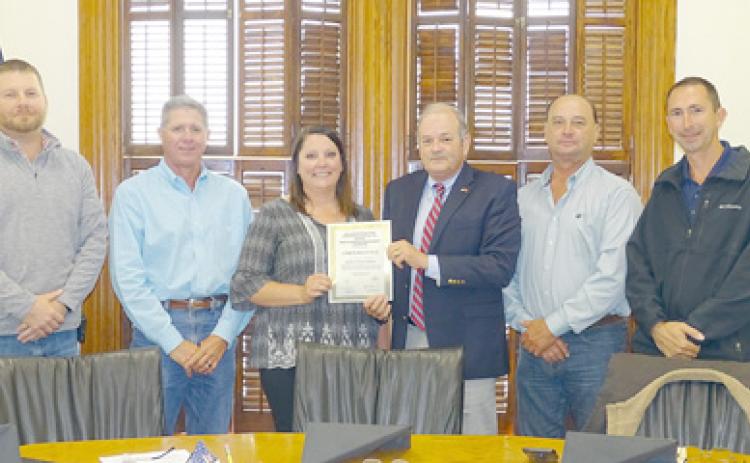 During the meeting held on Thursday, April 22, the Fayette County Commissioners Court acknowledged Amber Hielscher (third from left) for achieving her Certified Floodplain Manager Certificate. Congratulating her during the Commissioners Court meeting were: (from left) Precinct 4 Commissioner Drew Brossmann, Precinct 3 Commissioner Harvey Berckenhoff; (from right) Precinct 1 Commissioner Jason McBroom, Precinct 2 Commissioner Luke Sternadel, and County Judge Joe Weber. Photo By Melanie Berger