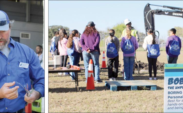 Career Day – Photo at left: Colorado Valley Communications employee Greg Janda (right) shows the structure of a cable. Photo at right: A sign in the foreground explains that boring and construction are “best for students who enjoy hands-on work, teamwork and being outdoors.”