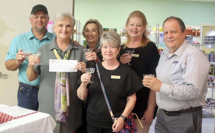 CHAMBER OF COMMERCE –  Shown are (from left):  Paul Zapalac, Chamber di rector Debra Blansitt, Schulenburg  Area Food Pantry president;  Diana Mikesky, Chamber  president; and  Nina Howard, Tammy Treybig and Rodney Kalich, Chamber directors.