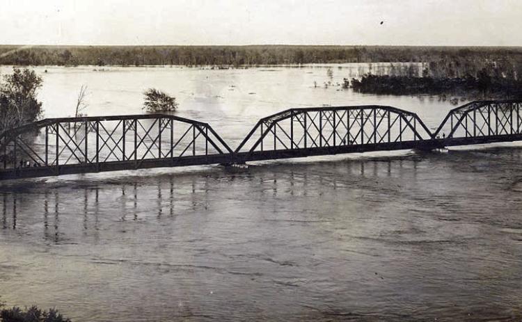 Photograph of the MKT railroad bridge across the Colorado River at La Grange on the evening of Dec. 5, 1913. Courtesy of Fayette Heritage Museum &amp; Archives