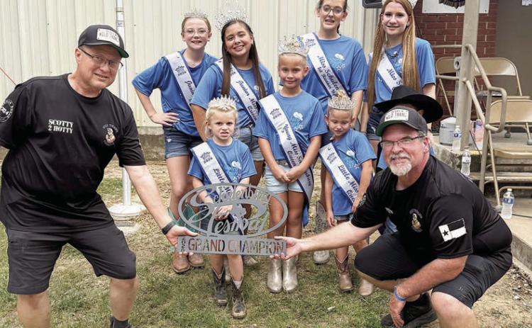 GRAND CHAMPION / 1ST PLACE CHICKEN – “Wild Thang Cookers” of Cameron, represented by Steve Siebeneicher and Scott Lusk. Also shown is Miss Schulenburg and her court. Sticker Photo By Layne Vyvjala