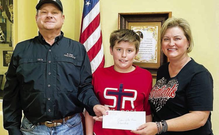 Roland Vacek (left) was the St. Rose winner in the Catholic Life Insurance sweepstakes. He purchased his ticket from his nephew, Nathan Vacek (center). Also shown is Jeannie Mican (right), St. Rose School administrative assistant.