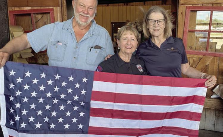 U.S. flag was presented to the Colorado County EMS in Weimar by the Schulenburg Hermann Sons Life lodge. Shown are (from left) lodge president Ed Moeller, Marilyn Hinze of Colorado County EMS and lodge vice president Mary K. Seifert.