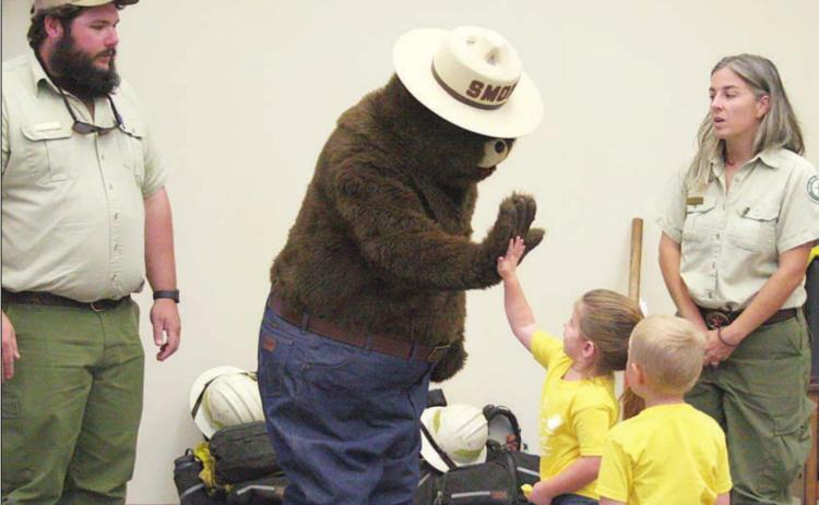 Smokey Bear visits library