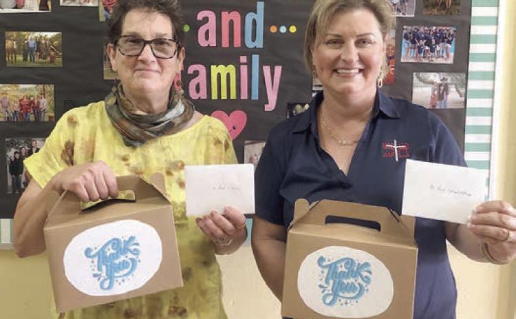 Baked Goods – St. Rose of Lima Catholic School, represented by Jeannie Mican (right), received baked goods from Senior Connections, represented by Stephanie Shroyer (left).