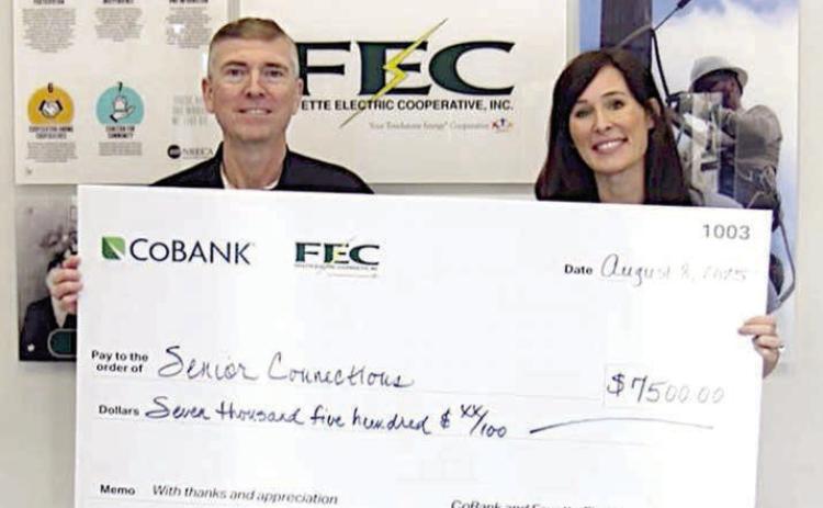 Navidad Valley Community Connections DBA Senior Connections received a $7,500 grant from FEC and CoBank. Shown are (from left) FEC General Manager/CEO Doug Lambert and Senior Connections executive director Amanda Kridel.