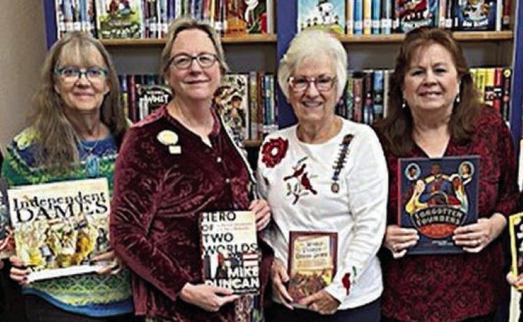 Donation to Schule nburg Publ ic Library – (from left) Juli McCroskey, DAR member; Cindy Lytle, Schulenburg Public Library staff; Kim Joost, Smith-McMillan Chapter librarian; Carolyn Caflisch, Smith-McMillan Chapter regent; Donna Holub, Schulenburg Public Library staff; and Lori Schultz, DAR member.