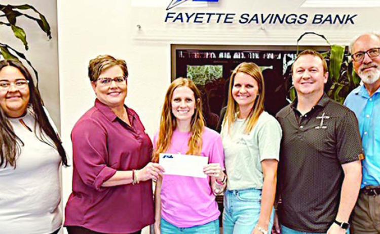 On hand as Fayette Savings Bank presented a donation to Led + Fed were (from left) Elvia Lara, FSB; Cheryl Brossmann, FSB; Jenny Neiser, Led + Fed executive director; Jennifer Neiser, Led + Fed board member; Nathan Neiser, Led + Fed board member; and Mike Olle, FSB.