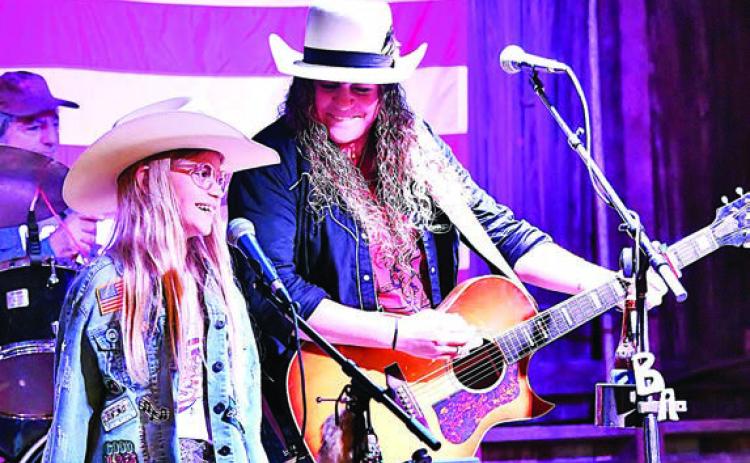 Briana Adams (right) was joined by Marley Vasek (left) for a performance at Holman Valley Steakhouse that raised funds for three animal welfare organizations in the area. Adams is a singer/songwriter who grew up in Winchester and has been touring all over Texas for the past 12 years.