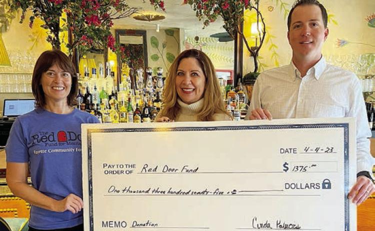 Lulu’s raised $1,375 for the Red Door Fund for Mental Health. Shown at the check presentation are (from left) Christine Scully of RDF; Cinda Palacios of Lulu’s; and Jordan Beeman, president of HeartBrand Beef, which provided steaks for the benefit dinners.