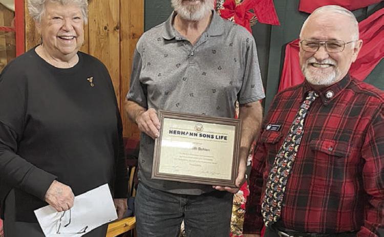 Kenneth R. Behlen (center) accepts the Hermann Sons Life “Humanitarian Award” from Lodge 14 Secretary Junette Rodecap (left) and Grand Lodge Director, David Noak.