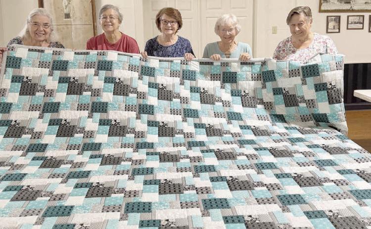 This handmade quilt will be auctioned at the annual picnic of St. Mary’s Catholic Church in High Hill on Sunday, Sept. 6. St. Anne’s Society members who constructed the quilt included (from left) Jan Ripper, Karen Miley, Lillian Hilscher, Georgia Cerny and Lorine Machicek. The auction will start at 1 p.m. The picnic will also include a flag-raising, dedication of the High Hill cross, Mass, fried chicken/stew dinner, music/dance, fireworks show and numerous other activities.