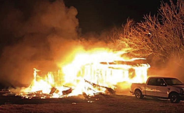 An early-morning blaze destroyed a home in the Swiss Alp area, as reported in the Feb. 17 issue.