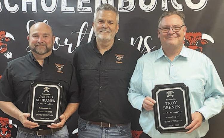 Outgoing trustees recognized at Monday night’s school board meeting by Superintendent Lee Hafley (center) were Jarrod Schramek (left), 10 years, and Troy Brenek (right), three years. Sticker Photo By Darrell Vyvjala