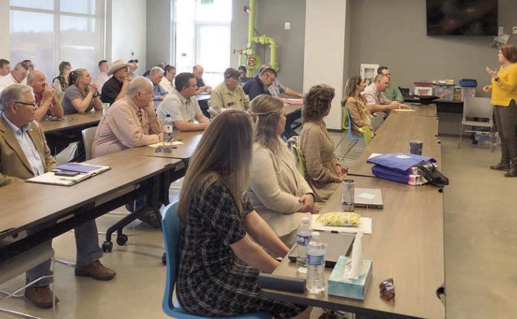 Newly-appointed Emergency Management Coordinator Angela Hahn addresses the group of officials and community leaders who attended a meeting on the County’s mitigation plans last week.