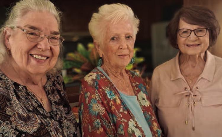 Hostesses were (from left) Jan Ripper, Mary Demel and Lily Hilscher.
