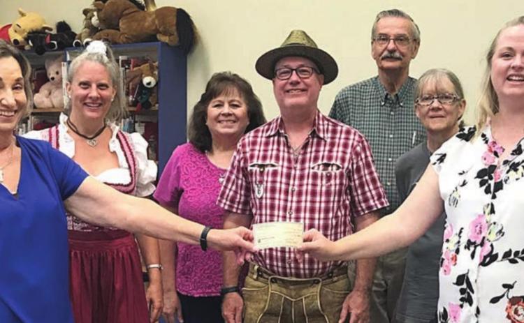 On hand as a check was presented by the Lions Club as sponsorship of the Das ist Lustig performance at the Schulenburg Public Library were (from left) Diana Mikesky, president of the Friends of the Schulenburg Public Library; Valina Polka of Das ist Lustig; Donna Holub, librarian; Ross Polka of Das ist Lustig; Thadious Polasek, library director; Cindy Lytle, librarian; and Kristi McBride, president of Schulenburg Lions Club.