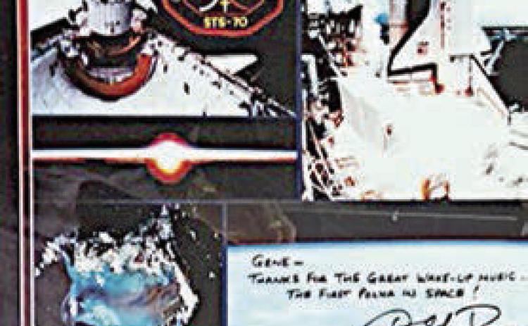 Photos given to Gene Hackemack including a photo of the astronauts. The handwritten note reads: “Gene – Thanks for the great wake-up music. The first polka in space!”