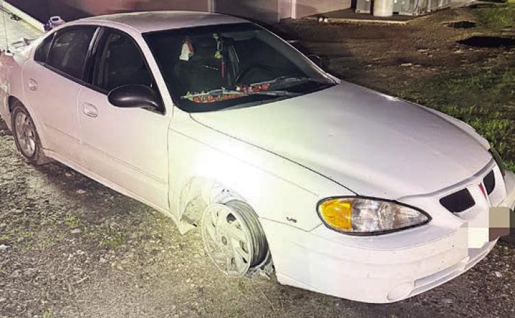 The vehicle, minus front tires, that was eventually stopped by tire deflation devices after a high-speed pursuit.