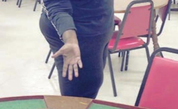 SHOWING OFF HER Mexican Train dominoes at the NVCC Senior Center is Alfreda Ellison