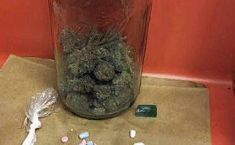 Pictured are the drugs and a weapon that were recovered by the SPD from a traffic stop on I-10 on Aug. 8.