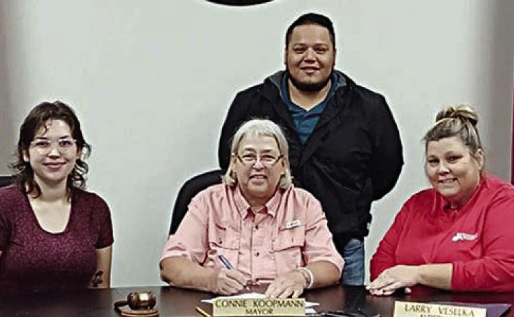 A proclamation recognizing the contributions of the Parents As Teachers program was signed by Schulenburg Mayor Connie Koopmann. On hand were (front row, from left) Dallas Garza, PAT parent educator; Mayor Koopmann; Karen Hoskins, PAT program director; and (back) Josue Rivas, PAT program developer.